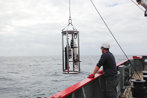 Georgio Dall'olmo watching optics rig being lifted out of the water