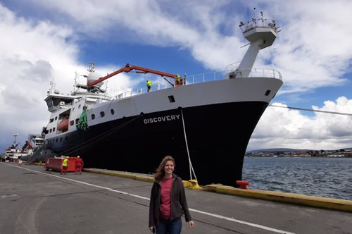 Ophelie Meuriot standing in front of the RRS discovery in port